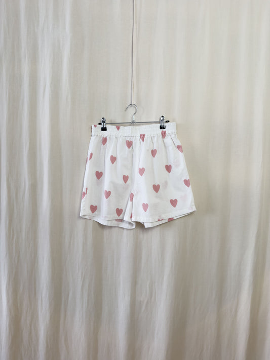 Shorts in white cotton with pink hearts